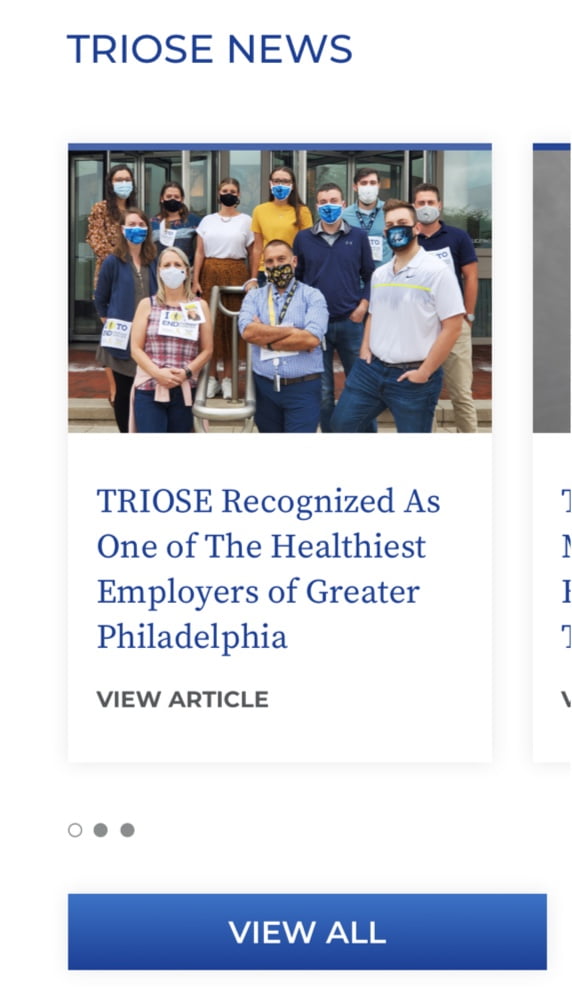 TRIOSE news section with article headline + photo of employees in masks